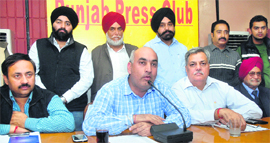 Members of the Jalandhar Marriage Palace Owners Association address a press conference in Jalandhar on Wednesday. 