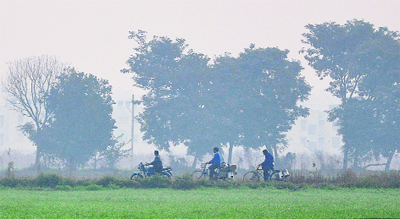  With winters having set in, commuters cope with fog in Jalandhar.