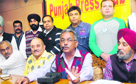 Satish Thakur Gora addresses a press conference in Jalandhar on Thursday. 