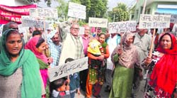 Farmers stage a protest in Reasi on Thursday. A Tribune photograph