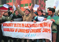 Members of the Jammu and Kashmir Democratic Youth Federation shout slogans during a protest in Srinagar on Thursday. tribune Photo: Yawar Kabli