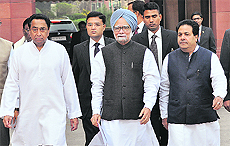 Prime Minister Manmohan Singh arrives at the Parliament House on the first day of the winter session in New Delhi on Thursday.