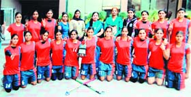Members of the team of the BBK DAV College for Women pose for a photograph after winning the Guru Nanak Dev University Inter-College Hockey Championship in Amritsar
