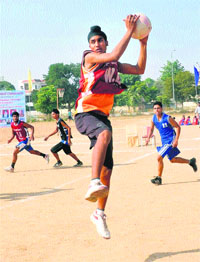 Players of Mansa and Sangrur in action during the seventh Junior State Netball Championship at Dasehra Ground in Mohali on Friday.