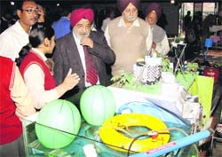 RS Khandpur, Director General, Pushpa Gujral Science City, takes a look at models during an exhibition organised by students in Kapurthala on Friday. Photo: Sarabjit Singh