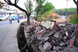 A demolished wall of Kala Kendra which was dismantled for the sake of the upcoming Expressway Corridor (flyover) near Bikram Chowk in Jammu.