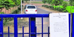 A notice pasted on the gate of the PAU stating that the gates have been closed due to security reasons in Ludhiana. 