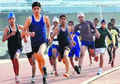 Athletes participate in the Inter-Zonal Athletics Meet at the Guru Nanak Stadium in Ludhiana on Friday. Tribune Photo: Himanshu Mahajan