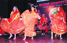 Students perform a dance item during the 6th District Inter-School Competition organised by the Satyug Darshan Sangeet Kala Kendra at Art Gallery in Amritsar on Saturday