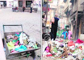 A garbage trolley stationed near the starting point of the Heritage Walk; and (right) garbage strewn on the Heritage Walk in Amritsar on Saturday