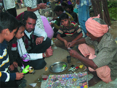Ram Chander explains the principle behind the functioning of a putt putt boat at Virasat Mela.