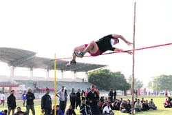 An athlete participates in a high jump event during the 10th Uttarakhand Police Inter- District Athletics Meet  in Dehradun on Saturday. Tribune photo: Vinod Pundir 
