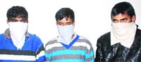 The theives nabbed by the police in Dehradun on Saturday. A Tribune photograph
