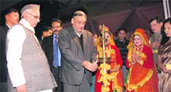 Chief Minister Vijay Bahuguna inaugurates a cultural programme on Uttarakhand Day at the Indian International Trade Fair in New Delhi on Saturday. 