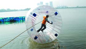 A man enjoys zorbing at Thermal lake in Bathinda on Sunday.