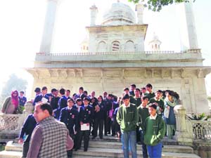 Students at Guru Ram Rai Darbar during the heritage walk organised by Spic Macay in Dehradun on Sunday. 