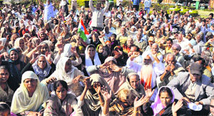 Members of the Jammu Kashmir POK Refugee front 1947, 1965, 1971 at Maheshpura chowk in Jammu on Sunday. 