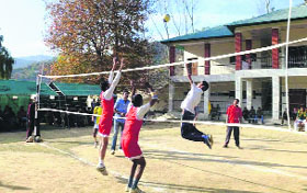Players in action during the volleyball tournament in Rajouri on Sunday