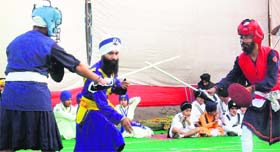 Players in action during the National Gatka Competition at Guru Teg Bahadur Gurudwara in Jalandhar on Sunday.