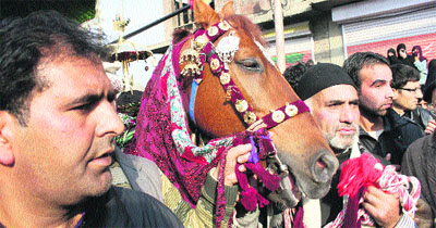 Shiite Muslims attend a mourning procession during Muharram in Srinagar on Sunday.
