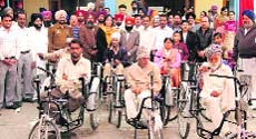 Physically challenged persons with tricycles at Mandi Gobindgarh on Sunday. 