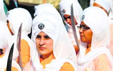 Devotees take part in a nagar kirtan to celebrate the birth anniversary of Sri Guru Nanak Dev in Ludhiana on Sunday. 