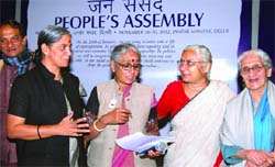 Social activists Medha Patkar, Annie Raja and Binayak Sen during a seminar on Peoples Assembly in New Delhi on Monday. Tribune photo: Manas Ranjan Bhui