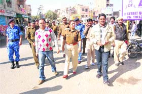 Deputy Commissioner J. Ganesan (right) and SSP Rajshree Singh patrol a market during curfew relaxation in Sirsa on Monday