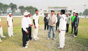 Principal and Director of MNSS, Rai, VK Verma spins the toss in the final match between Modern Public School, Delhi, and MNSS, Rai. 