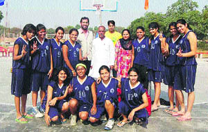 A group photo of the Delhi University team with Ravinder Singh Hooda, the state president of the Haryana Basketball Association. 