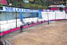 Workers at the ice-skating rink in Shimla on Monday