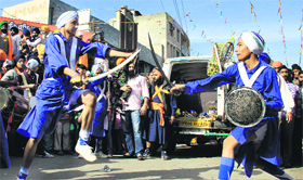 Sikh youths show gatka skills during a nagar kirtan held two days ahead of the birth anniversary of Guru Nanak Dev in Jalandhar on Monday.