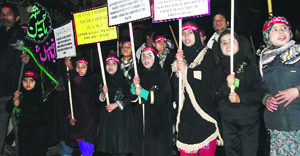 Members of Shia community take part in Zuljinnah processions in Srinagar on Monday.