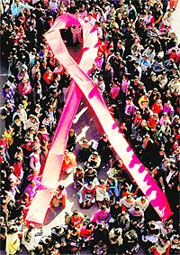 NSS volunteers make the red ribbon symbol during an AIDS awareness drive at the Post Graduate Government College for Girls in Sector 42, Chandigarh, on Tuesday