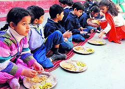 Students partake of langar during Gurpurb celebrations at Firstep Montessori School in Panchkula on Tuesday