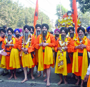  Panj Pyare in Nagar Kirtan on the occasion of Guru Nanaks birth anniversary at Gurdwara Sis Ganj in Delhi on Tuesday. 