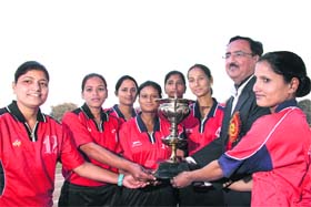 Uttarakhand IG BS Sidhu gives away the best overall performance trophy to women athletes of the 31st PAC Battalion during the conclusion of the 10th Uttarakhand Police Games in Dehradun on Tuesday