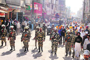 A heavy police force accompanies a nagar kirtan procession taken out in Sirsa on Tuesday.
