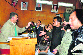 Councillors argue with the Mayor during a Municipal Corporation House meeting in Shimla on Tuesday.