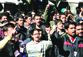 SFI activists raise slogans at the HPU in Shimla on Tuesday.