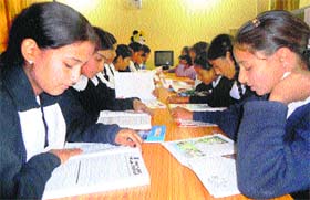 Students read books in the library at the Government Middle School in Rajouri on Tuesday