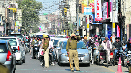 Police personnel regulate vehicular movement during the President's visit in Ludhiana on Tuesday. 