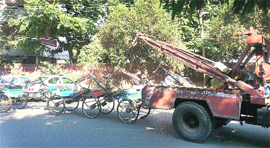 Officials of the Tehbazaari Wing of the Municipal Corporation tow away rickshaws that were wrongly parked in Ludhiana on Tuesday.