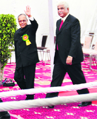 President Pranab Mukherjee waves at the students of Sat Paul Mittal School in Ludhiana on Tuesday. 