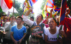 The exiled Tibetans shout slogans during a protest to express solidarity with those Tibetans who have immolated themselves in New Delhi on Wednesday. Tribune photo: Mukesh Aggarwal
