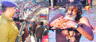A policeman keeps a watch at Har-ki-Pauri; and (right) a sadhu prays after taking a bath in the Ganga on the occasion of Kartik Purnima in Haridwar on Wednesday.