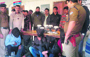 Members of a gang of criminals in police custody at Kashipur on Wednesday.