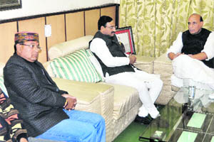 Senior BJP leader and former party president Rajnath Singh at the house of former Uttarakhand Chief Minister Ramesh Pokhriyal Nishank in Dehradun on Wednesday to mourn his wifes death. 