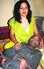 The acutely ailing professor of MD University, Dr Virender Malik, with his wife Vandana Malik at their home in Rohtak on Wednesday