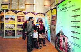 Visitors at the Photo and Calligraphy Exhibition held at Lal Ded Museum in Srinagar on Wednesday